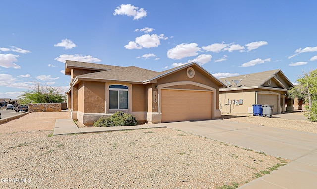 12729 Raul Mendiola Ln, El Paso, TX 79938 - ranch-style house with stucco siding, a garage, concrete driveway, and roof with shingles