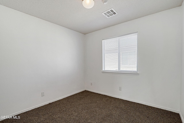 12729 Raul Mendiola Ln, El Paso, TX 79938 - empty room with dark carpet and baseboards