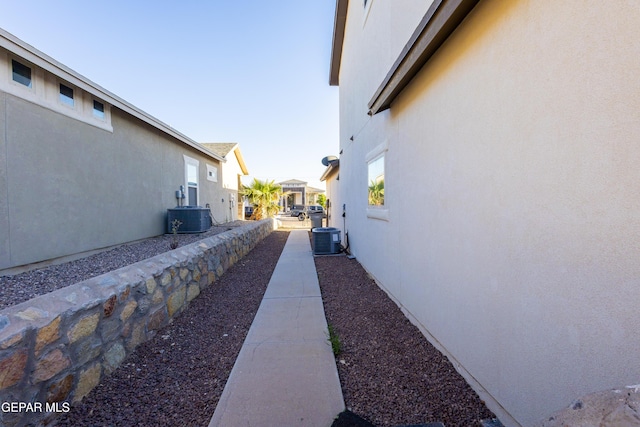 view of home's exterior featuring stucco siding and central AC