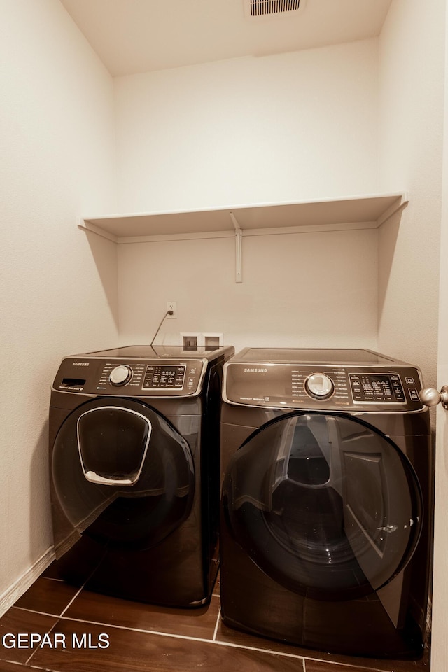 laundry room with separate washer and dryer