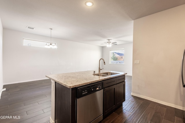 kitchen with dishwasher, a sink, dark wood finished floors, baseboards, and hanging light fixtures