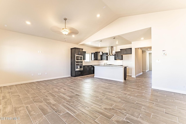 kitchen with stainless steel appliances, ceiling fan, ventilation hood, light countertops, and open floor plan