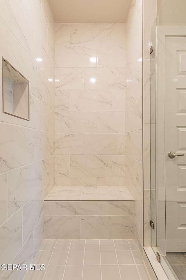 bathroom with a shower stall