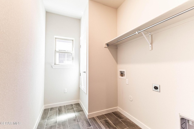 laundry room with hookup for an electric dryer, washer hookup, wood tiled floor, baseboards, and laundry area