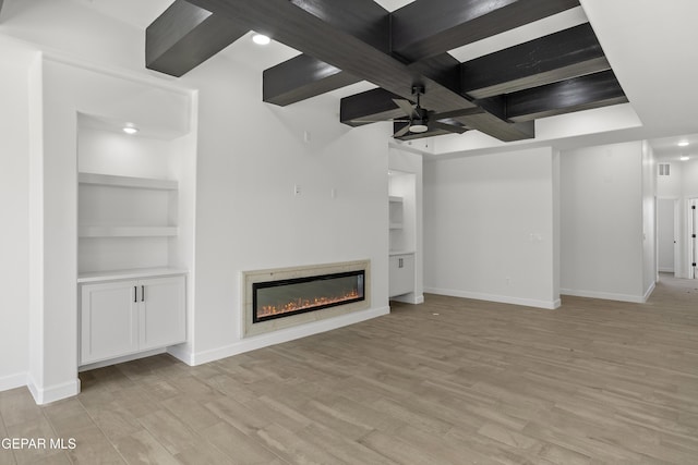 813 Durham Way, Horizon City, TX 79928 - unfurnished living room with ceiling fan, baseboards, a glass covered fireplace, and light wood-style floors