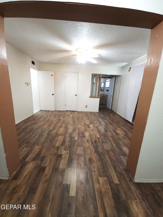 10850 Valle Grande Ct, El Paso, TX 79935 - empty room featuring wood finished floors, a ceiling fan, and a textured ceiling