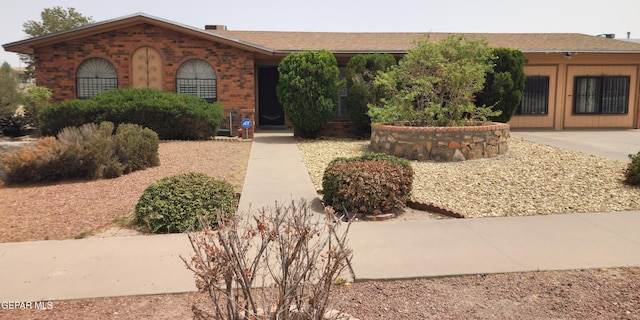 10850 Valle Grande Ct, El Paso, TX 79935 - ranch-style house with a shingled roof and brick siding