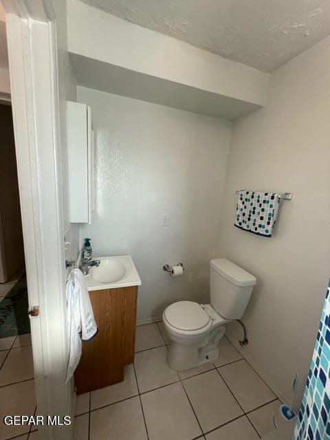 10850 Valle Grande Ct, El Paso, TX 79935 - bathroom featuring vanity, toilet, and tile patterned flooring