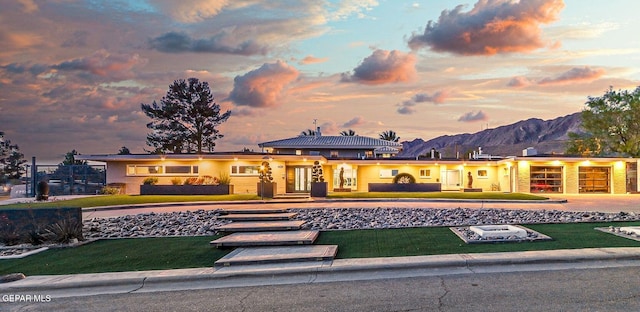 701 La Cruz Dr, El Paso, TX 79902 - prairie-style home with a yard, driveway, and a mountain view
