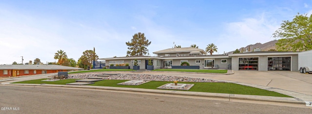 701 La Cruz Dr, El Paso, TX 79902 - view of front of house with a front lawn, a garage, and concrete driveway