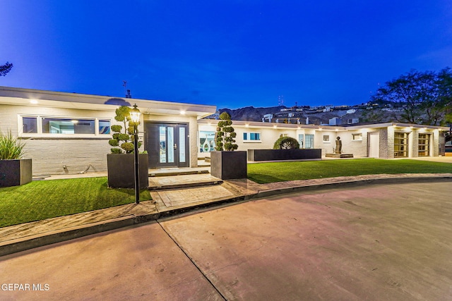 701 La Cruz Dr, El Paso, TX 79902 - view of front of property featuring french doors, a front yard, and brick siding