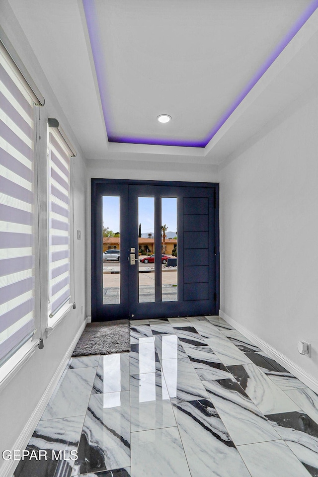 701 La Cruz Dr, El Paso, TX 79902 - entrance foyer with baseboards, recessed lighting, french doors, a raised ceiling, and marble finish floor