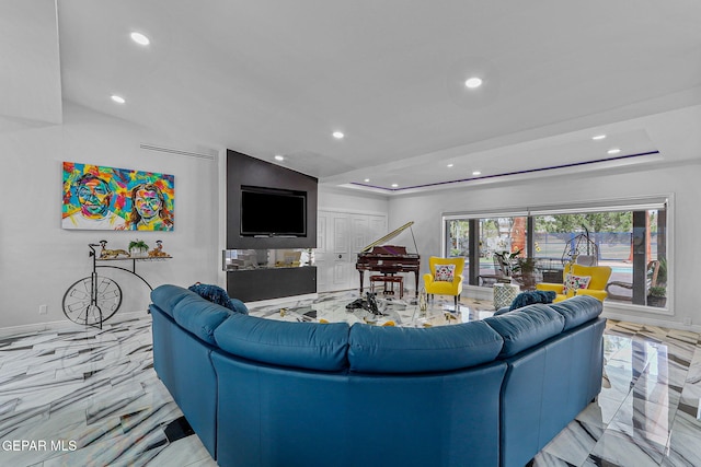 701 La Cruz Dr, El Paso, TX 79902 - living room featuring recessed lighting, a tray ceiling, marble finish floor, and baseboards