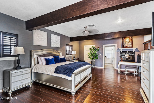 701 La Cruz Dr, El Paso, TX 79902 - bedroom featuring visible vents, baseboards, beam ceiling, and wood finish floors