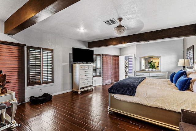 701 La Cruz Dr, El Paso, TX 79902 - bedroom with visible vents, a textured ceiling, wood finished floors, and beamed ceiling