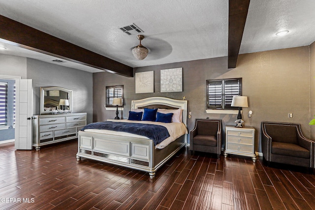 701 La Cruz Dr, El Paso, TX 79902 - bedroom with visible vents, a textured ceiling, beamed ceiling, and wood tiled floor