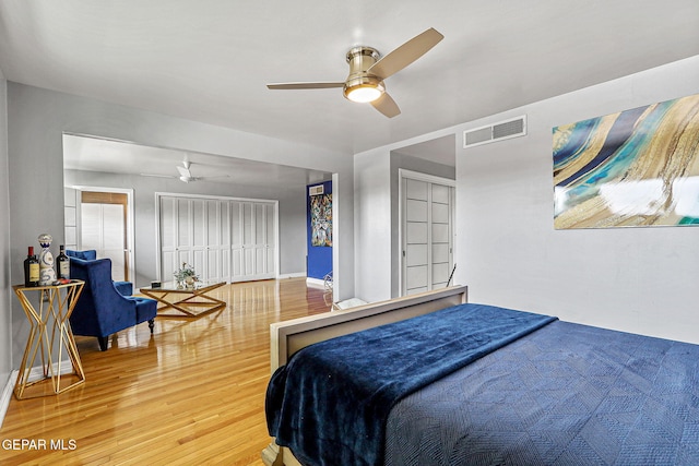 701 La Cruz Dr, El Paso, TX 79902 - bedroom with wood finished floors, ceiling fan, baseboards, and visible vents