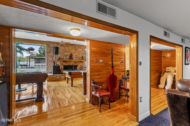 701 La Cruz Dr, El Paso, TX 79902 - interior space featuring hardwood / wood-style floors, wooden walls, and visible vents