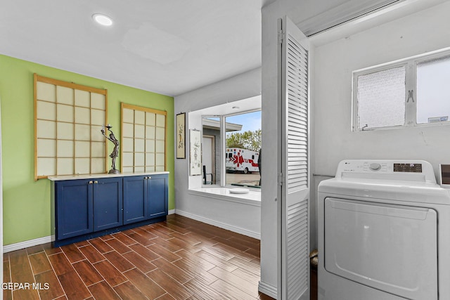 701 La Cruz Dr, El Paso, TX 79902 - clothes washing area with washer / dryer, laundry area, baseboards, and wood finish floors