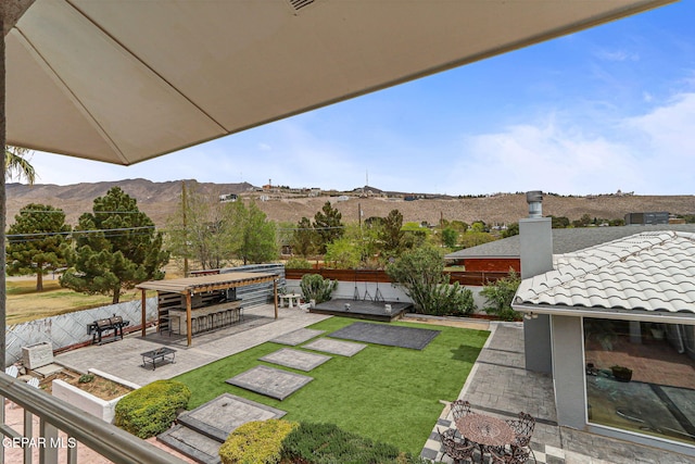 701 La Cruz Dr, El Paso, TX 79902 - view of yard with a mountain view, a fenced backyard, and a patio