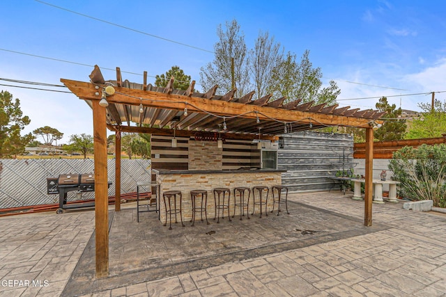 701 La Cruz Dr, El Paso, TX 79902 - view of patio featuring a pergola, outdoor dry bar, and fence