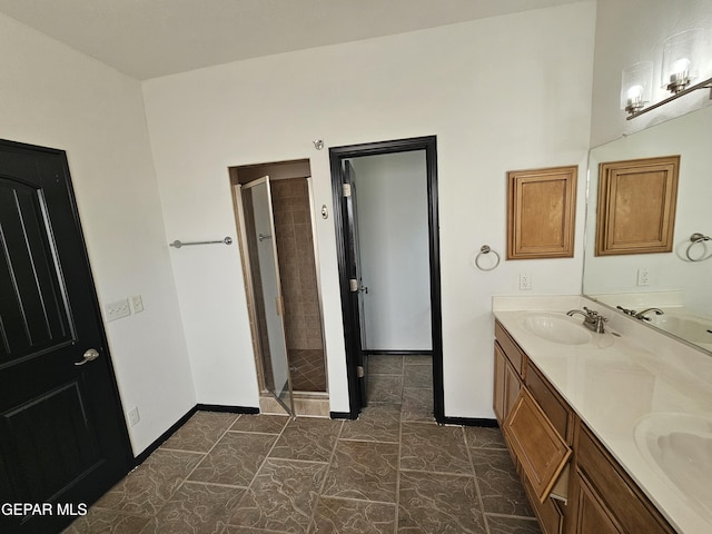 3864 Tierra Campa Dr, El Paso, TX 79938 - bathroom featuring a sink, baseboards, and a shower stall