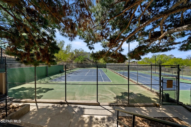 view of sport court with fence