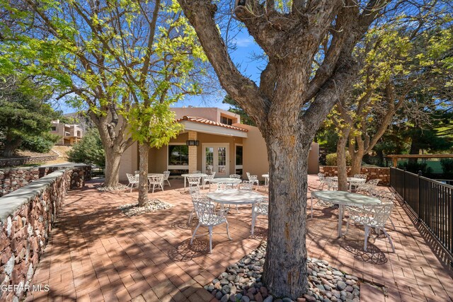 view of patio / terrace with outdoor dining area and fence