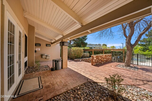 view of patio / terrace featuring fence