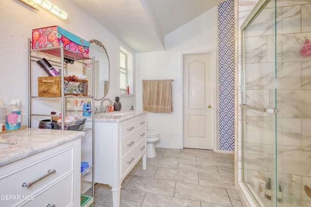 full bathroom with a shower stall, lofted ceiling, toilet, vanity, and baseboards