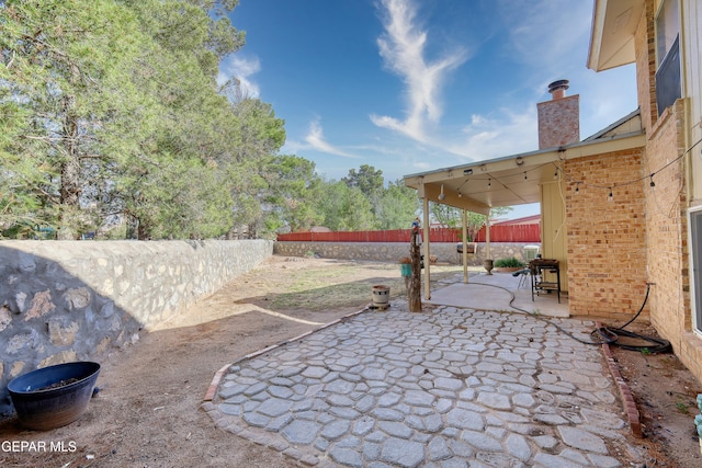 view of patio with a fenced backyard