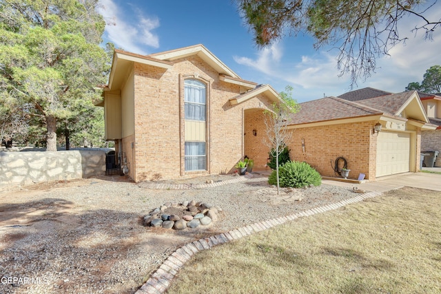 view of front facade featuring concrete driveway, brick siding, and a garage