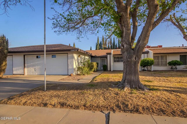 10632 Park View Cir, El Paso, TX 79935 - ranch-style home featuring an attached garage, concrete driveway, and stucco siding
