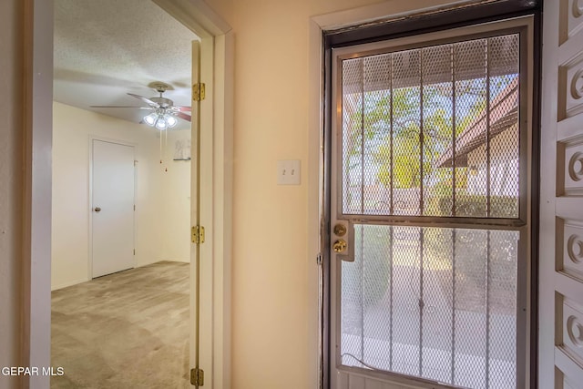 10632 Park View Cir, El Paso, TX 79935 - doorway with a textured ceiling and a ceiling fan