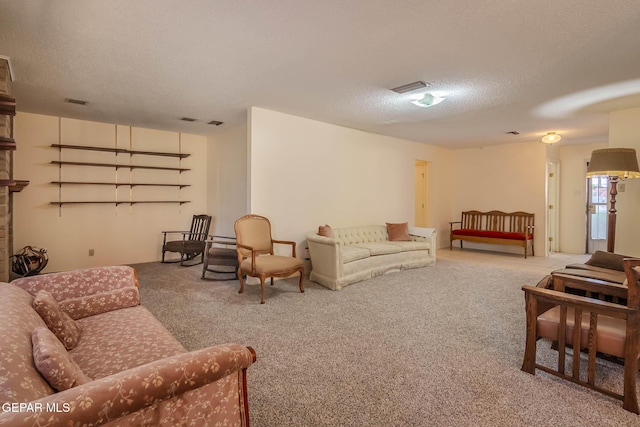 10632 Park View Cir, El Paso, TX 79935 - carpeted living area featuring visible vents and a textured ceiling