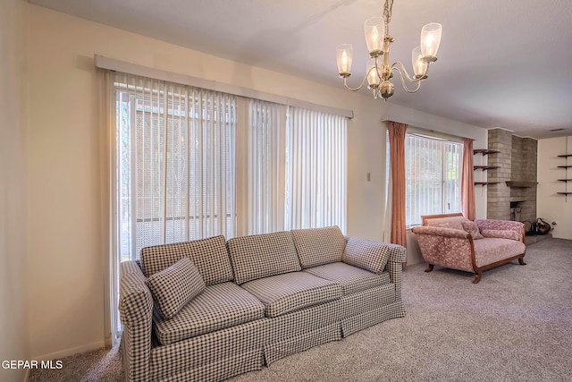 10632 Park View Cir, El Paso, TX 79935 - carpeted living room featuring a chandelier, a brick fireplace, and baseboards