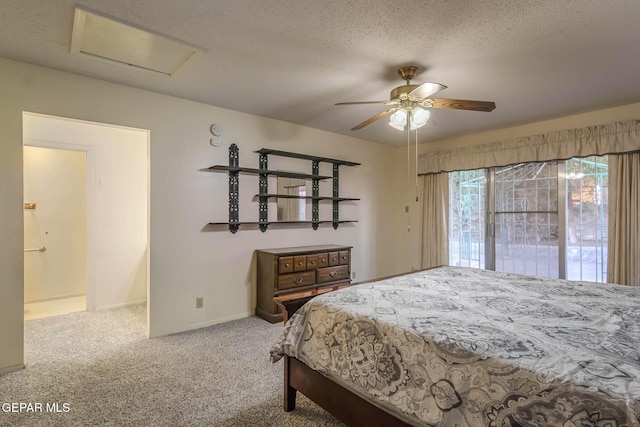 10632 Park View Cir, El Paso, TX 79935 - bedroom featuring baseboards, carpet flooring, a textured ceiling, attic access, and a ceiling fan