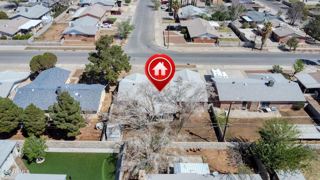 birds eye view of property with a residential view