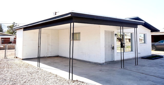 view of outdoor structure with fence