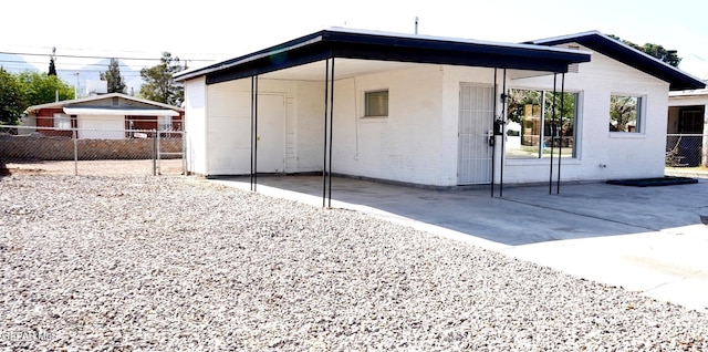 view of outdoor structure featuring fence