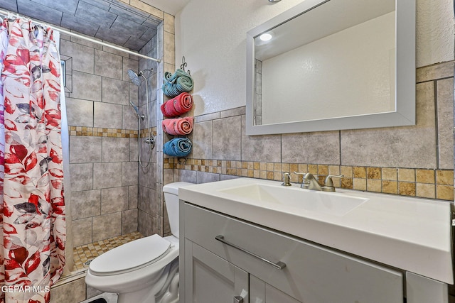 702 Thompson Rd, San Elizario, TX 79849 - full bath with toilet, a stall shower, vanity, and tile walls