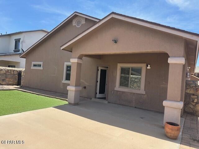 14325 Coyote Trl, El Paso, TX 79938 - view of front of house with a patio area and stucco siding
