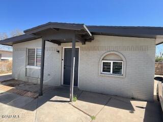 144 Marquita Ln, El Paso, TX 79915 - view of front of home with brick siding and a patio area