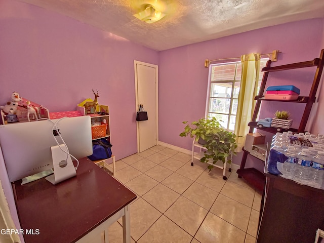 7726 Monterrey Dr, El Paso, TX 79915 - interior space featuring a textured ceiling, baseboards, and light tile patterned flooring