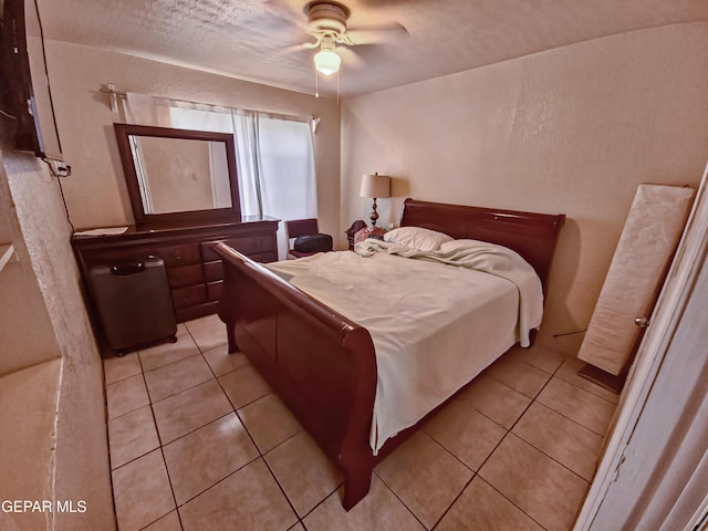 7726 Monterrey Dr, El Paso, TX 79915 - bedroom featuring a textured ceiling, light tile patterned flooring, and ceiling fan