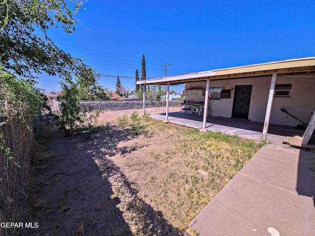 7726 Monterrey Dr, El Paso, TX 79915 - view of yard featuring a carport, fence, and a patio