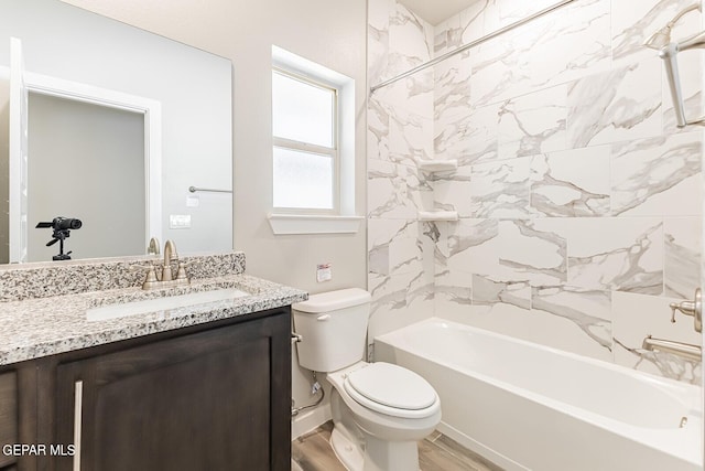 bathroom with toilet, shower / tub combination, vanity, and wood finished floors