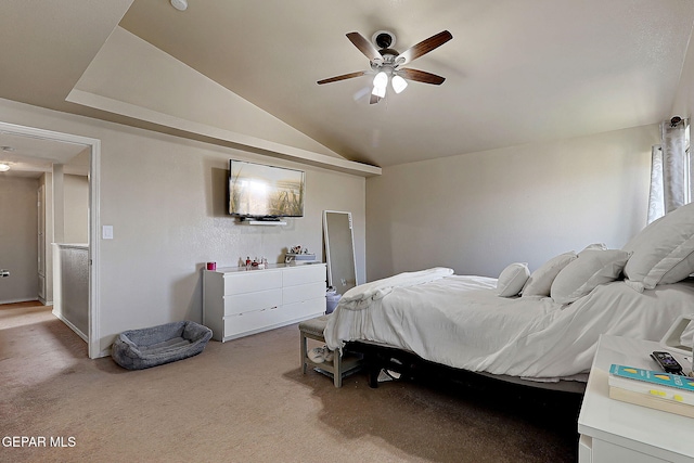 bedroom featuring light colored carpet, lofted ceiling, and ceiling fan