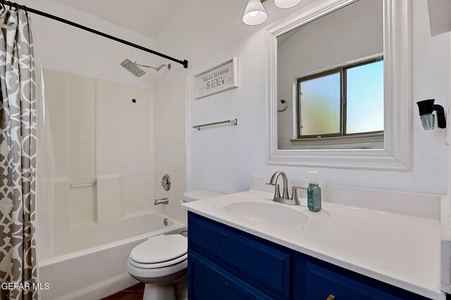 bathroom featuring toilet, vanity, and shower / bath combo