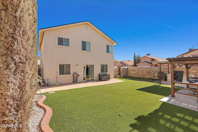 rear view of property with a pergola, a patio, and stucco siding